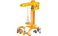 Baukran mit Baustellenzubehör